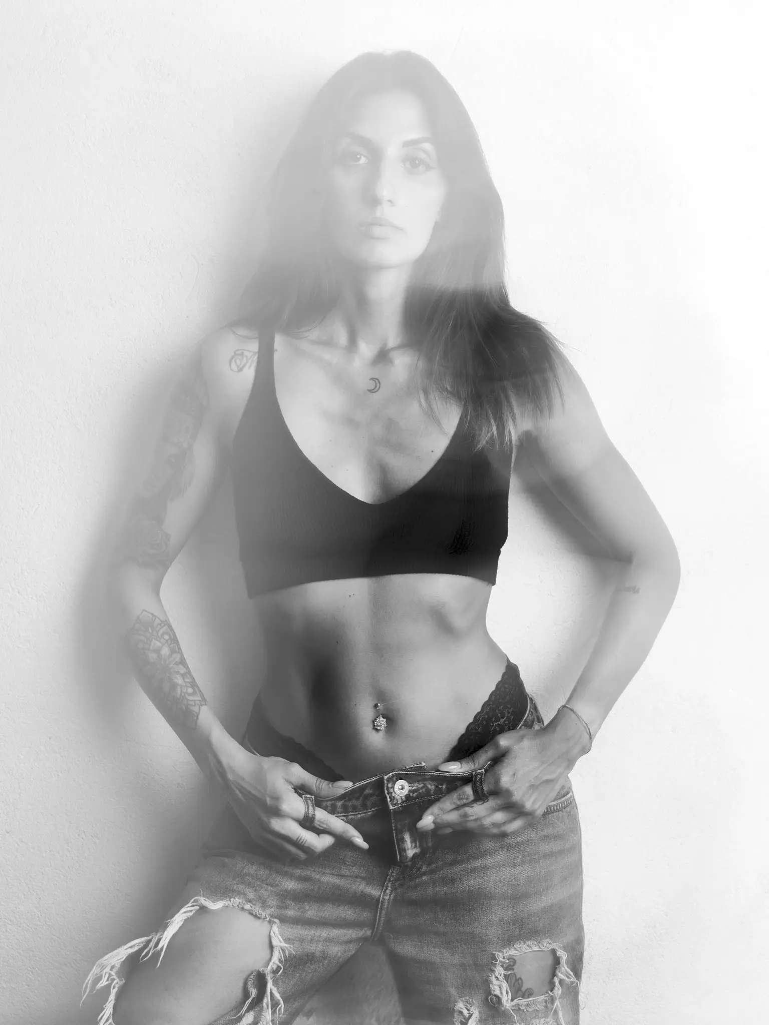 (e)Motion - Long Exposure black and white portrait of model with black top and jeans