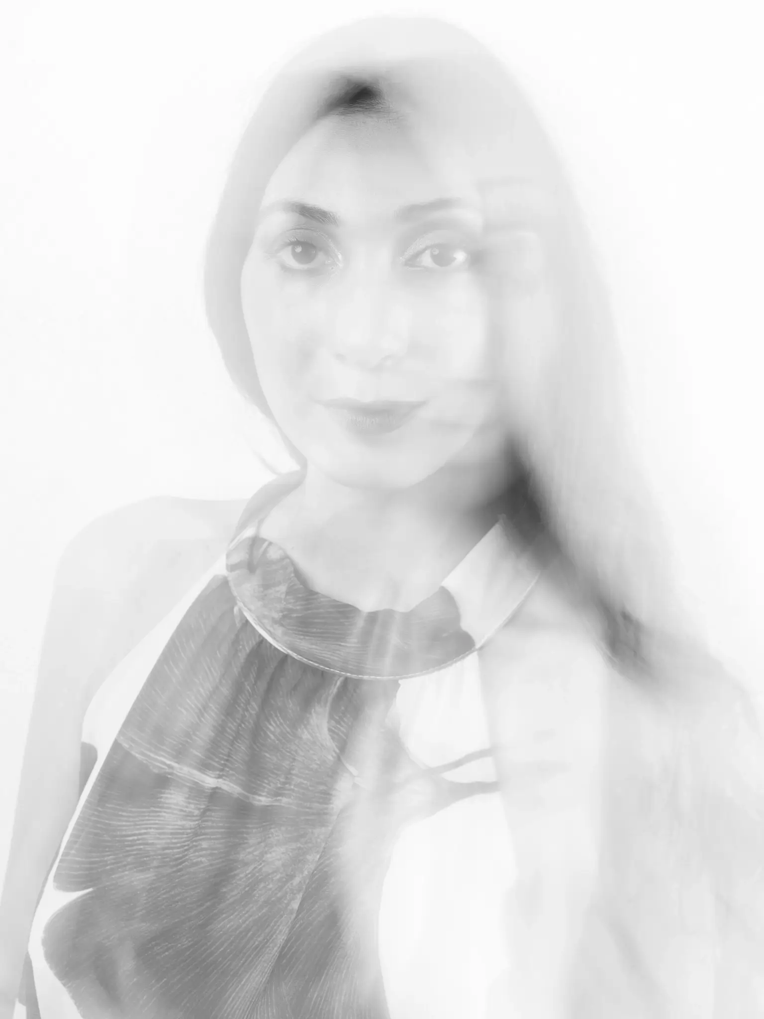(e)Motion - Long Exposure black and white portrait of model with floreal dress (e)Motion - Long Exposure black and white portrait of model with floreal dress