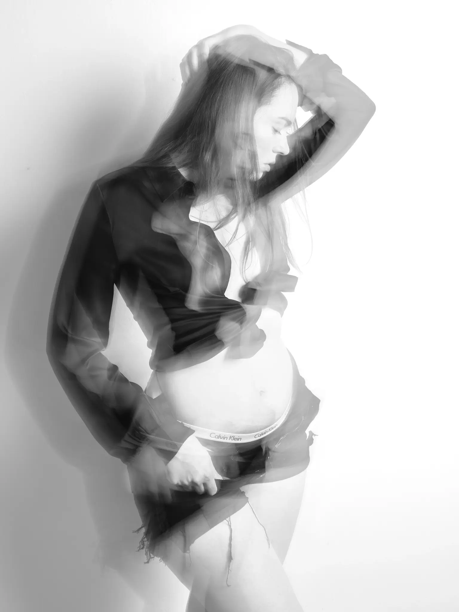 (e)Motion - Long Exposure black and white portrait of model with black shirt and shorts (e)Motion - Long Exposure black and white portrait of model with black shirt and shorts