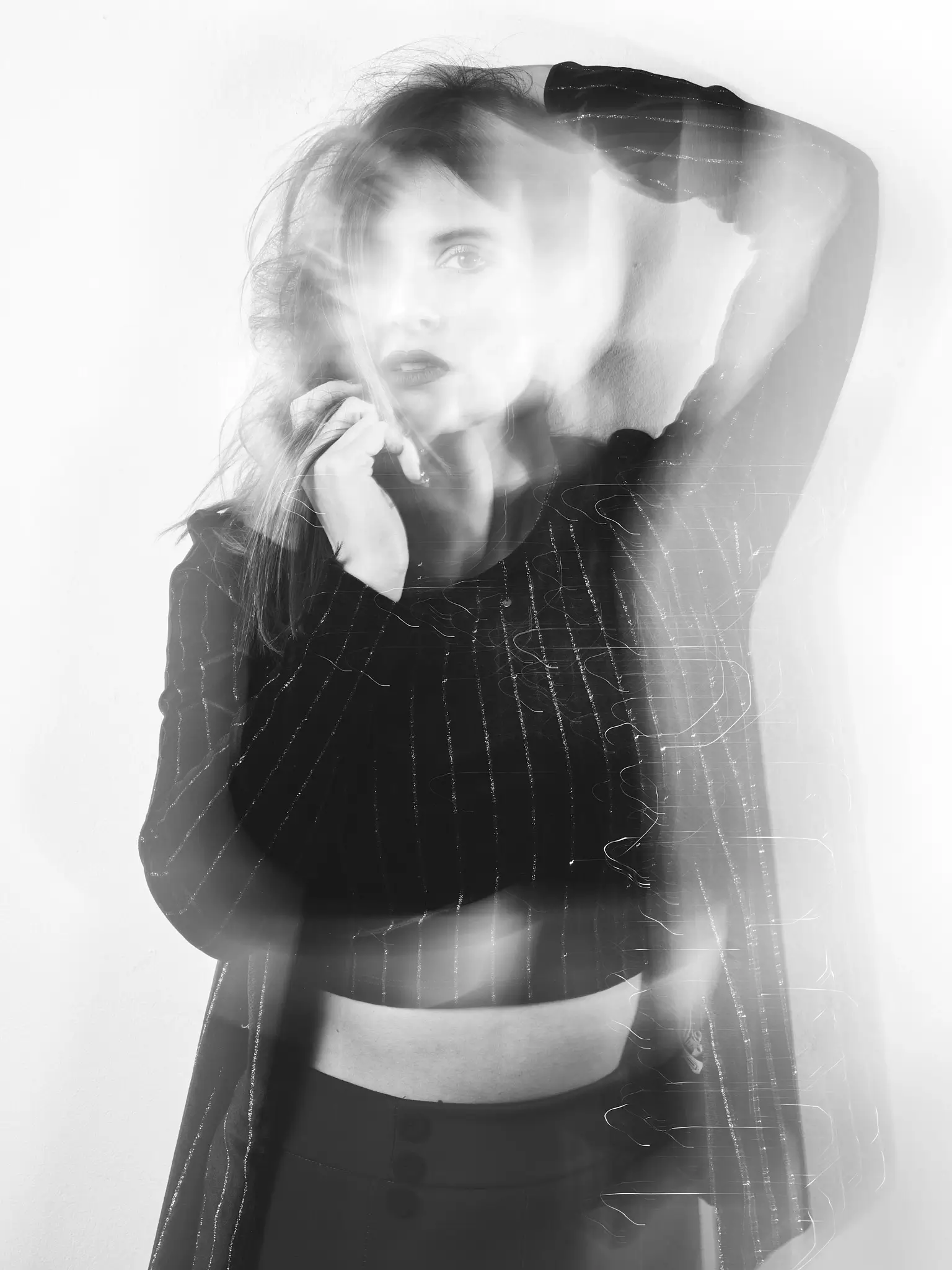 (e)Motion - Long Exposure black and white portrait of model with black dress (e)Motion - Long Exposure black and white portrait of model with black dress