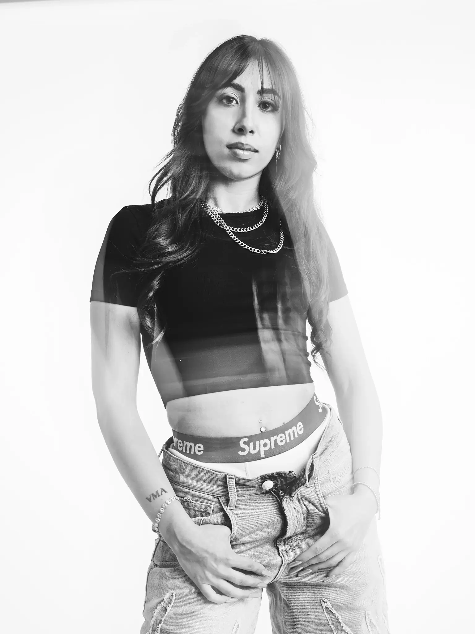 (e)Motion - Long Exposure black and white portrait of model with black tee and jeans (e)Motion - Long Exposure black and white portrait of model with black tee and jeans