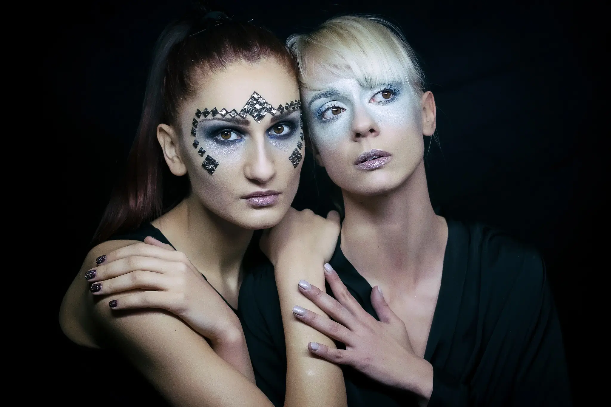 Portrait of two models in a futuristic makeup