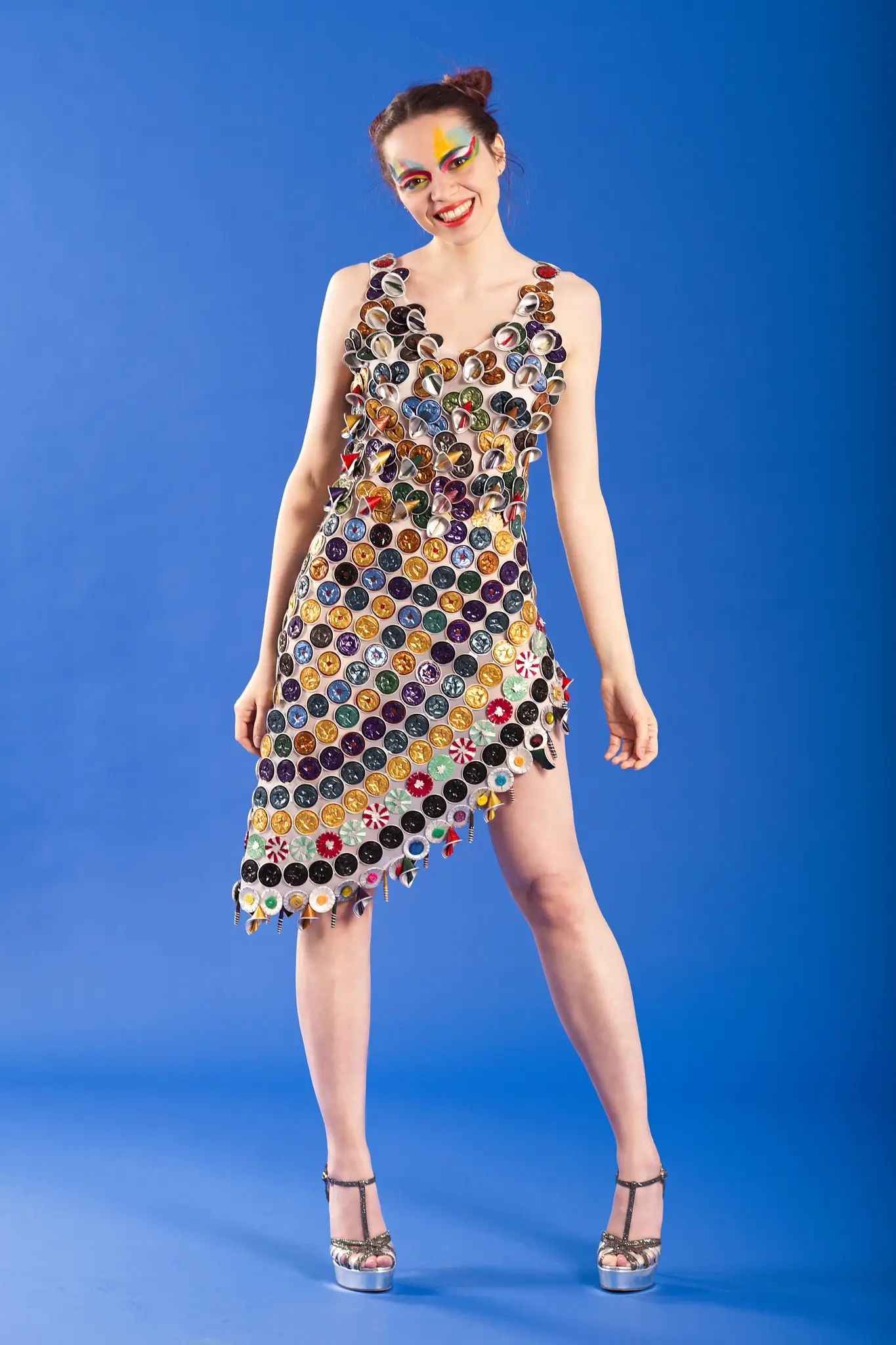 Studio portrait of a model wearing a dress completely created with Nespresso capsules