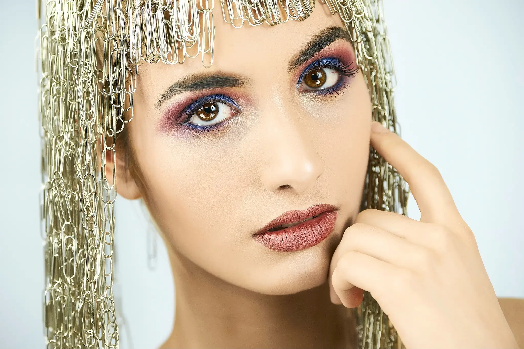 Studio portrait of a model with paperclips wig