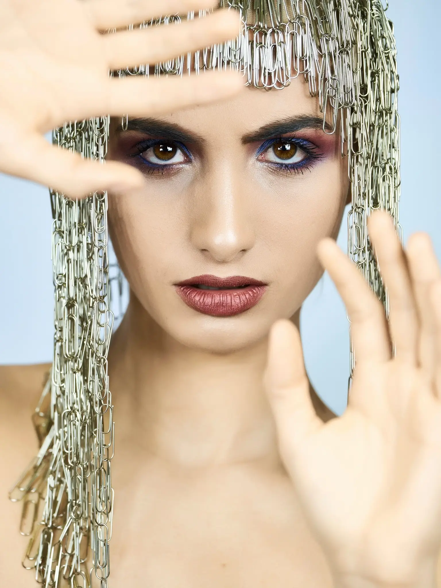 Studio portrait of a model with paperclips wig