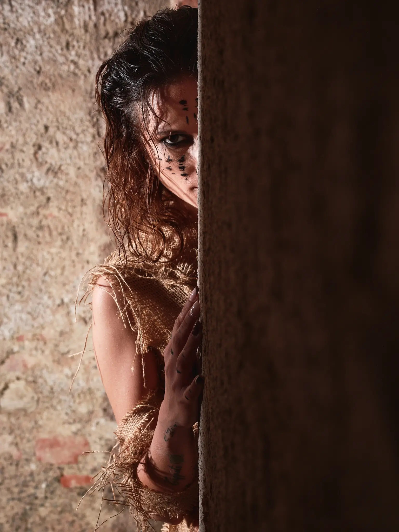 Photoshoot in a mysterious cellar with dramatic lighting