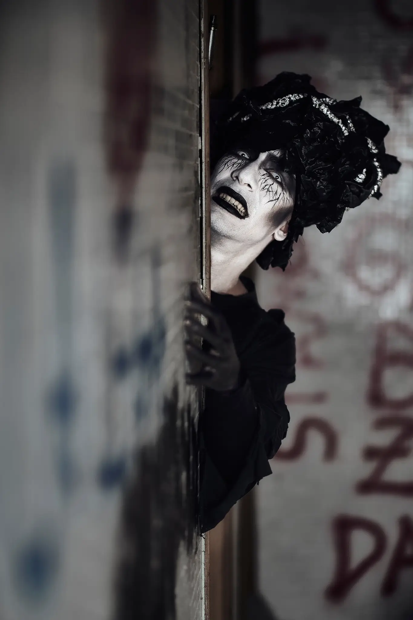 Artistic portrait captured in dim light, part of an unpublished Halloween shoot exploring fear, silence, and isolation.