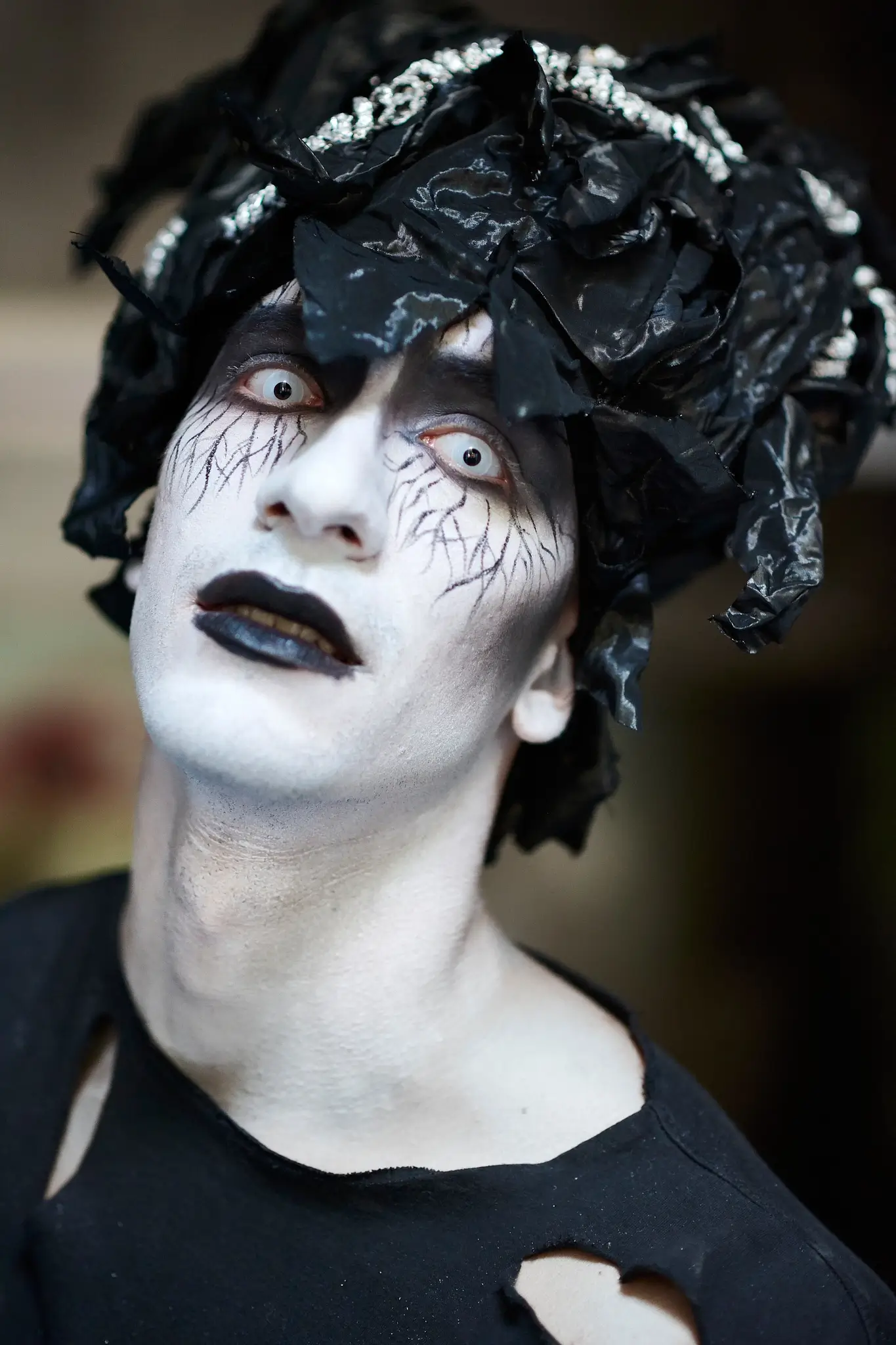 Close-up of eerie Halloween makeup created for a dark, unpublished photoshoot in an abandoned psychiatric hospital.