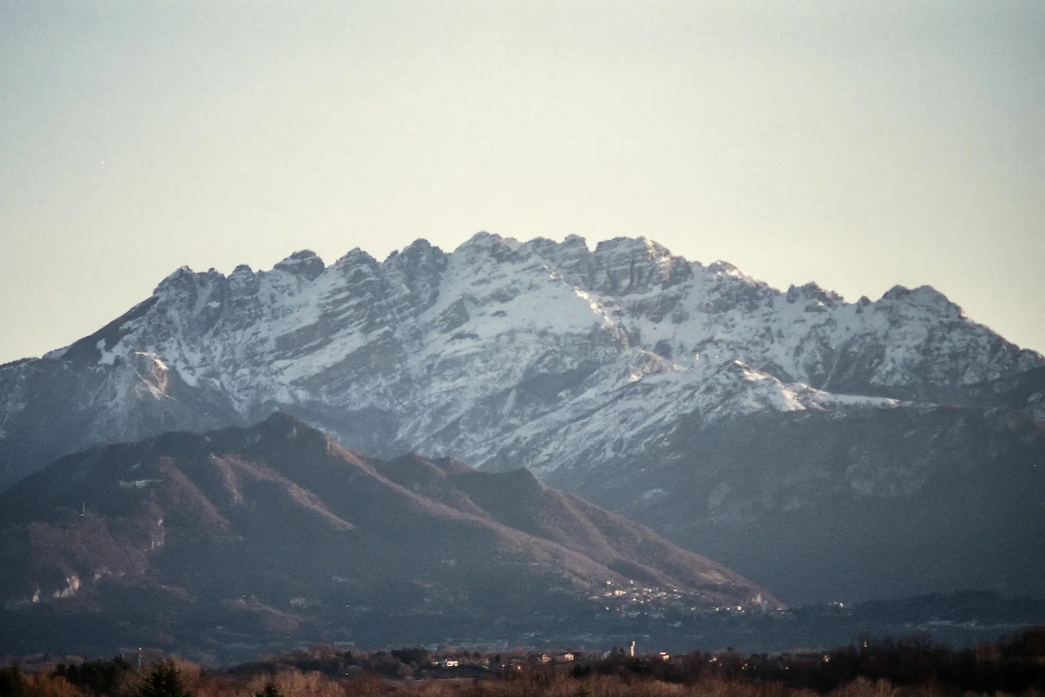Mountain landscape shot on 35mm film, evoking Christmas memories and winter calm
