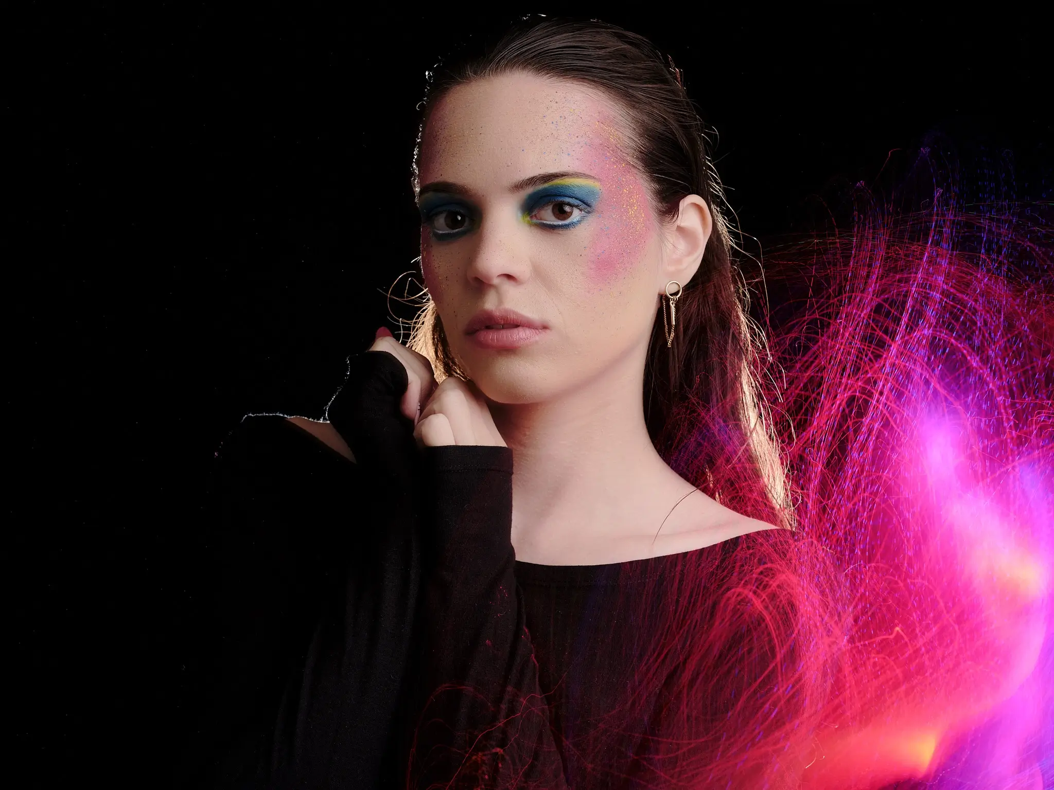 Artistic portrait with creative makeup and optical fiber light painting effects