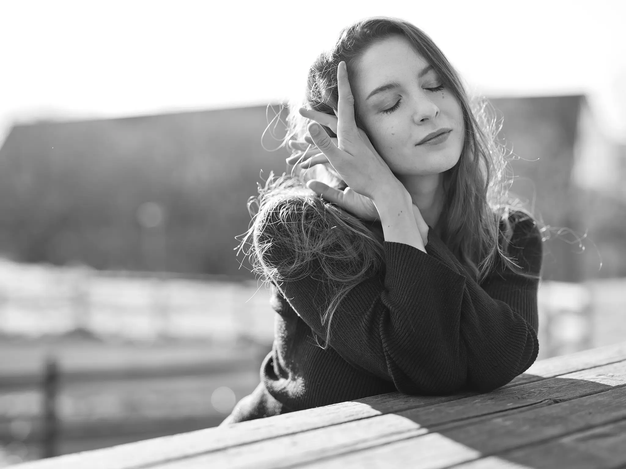 Black and white unpublished shot of Carlotta in winter, capturing a delicate and raw moment from the spontaneous set.